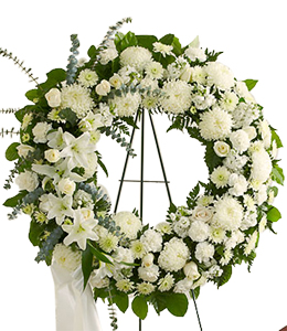 White_funeral_wreath_at_Scent_and_Violet_florist.jpg