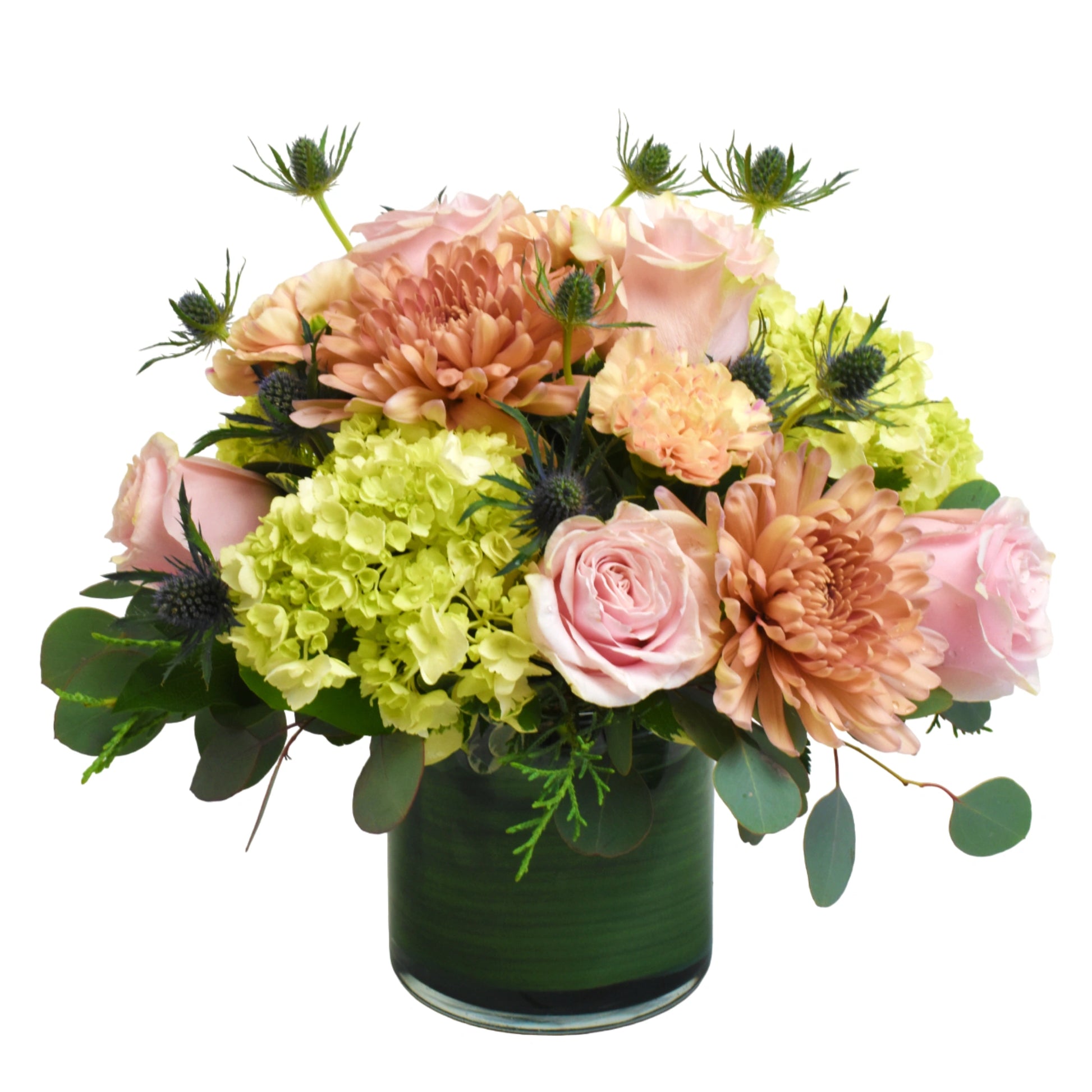 Apple Tea arrangement features peach, light pink and green tones of flowers such as hydrangea, roses, chrysanthemums 