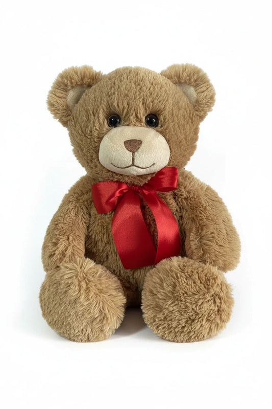 Tan brown teddy bear with a red bow 