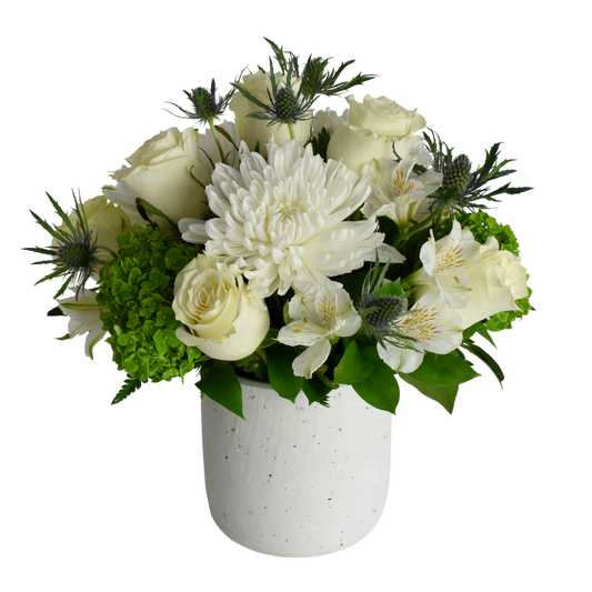 Healing White Flowers is an arrangement white flowers with green accents  arranged in a Hera Pot, handmade from clay with white textured finish