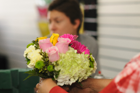 Making of a bouquet at Scent & Violet florist in Houston, TX. Photo by D. Osinulu